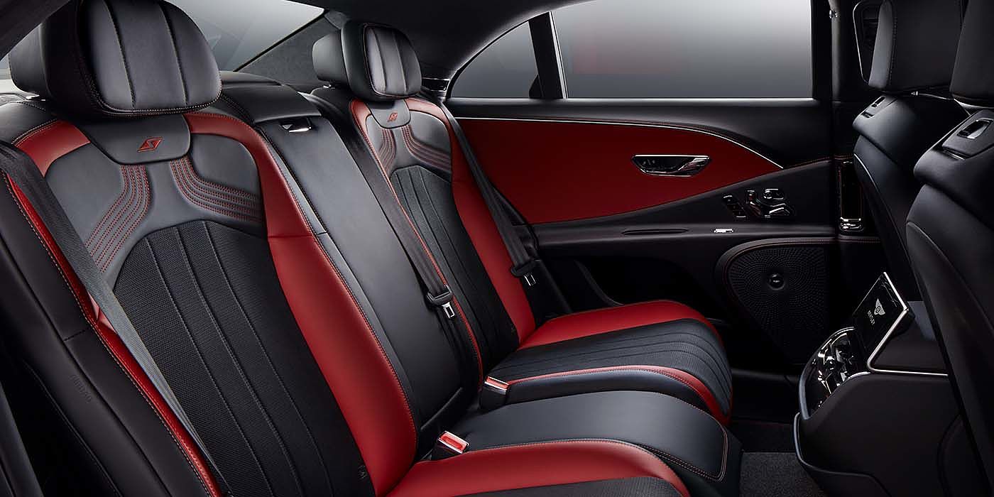 Bentley Bahrain Bentley Flying Spur S sedan rear interior in Beluga black and Hotspur red hide with S stitching