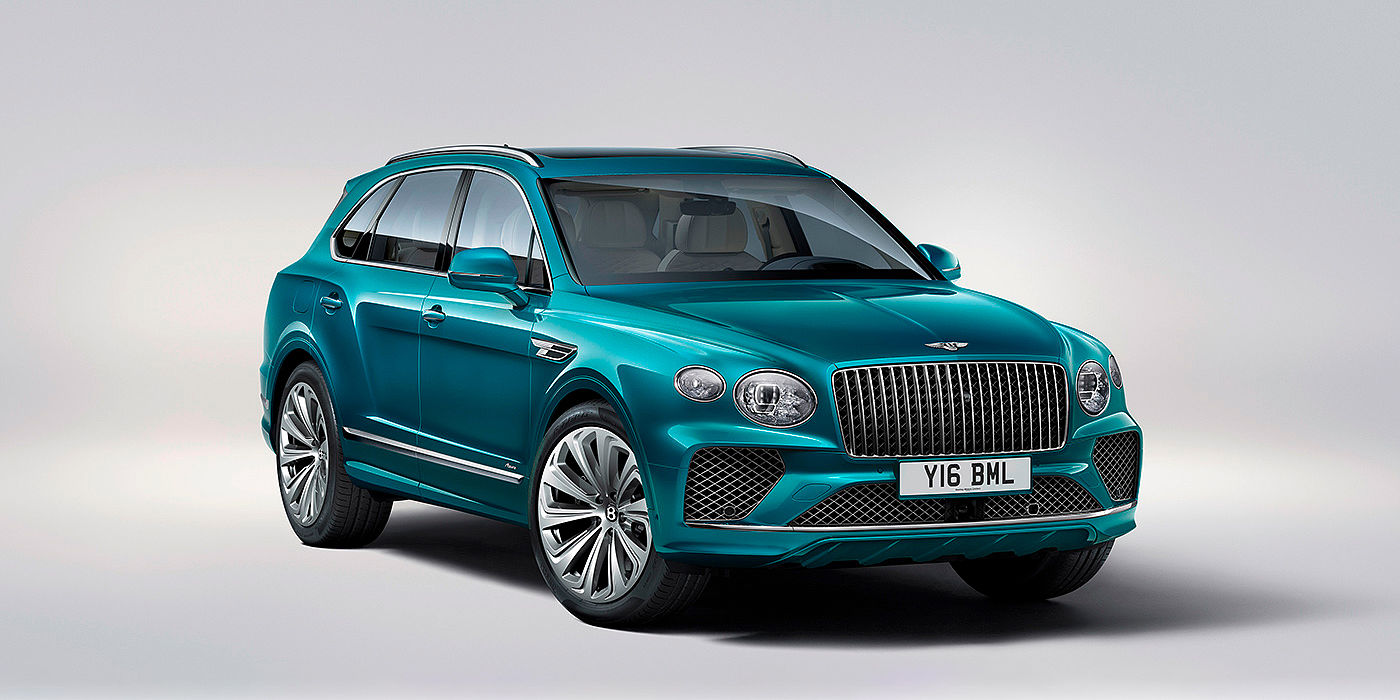 Bentley Bahrain Bentley Bentayga Azure front three-quarter view, featuring a fluted chrome grille with a matrix lower grille and chrome accents in Topaz blue paint.