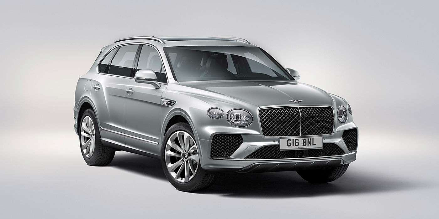Bentley Bahrain Bentley Bentayga in Moonbeam paint, front three-quarter view, featuring a matrix grille and elliptical LED headlights.