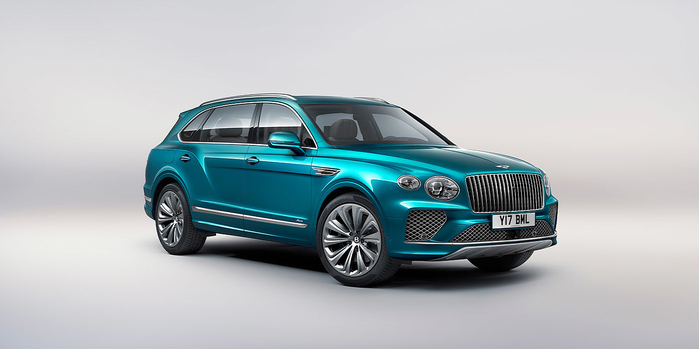 Bentley Bahrain Bentley Bentayga EWB Azure front three-quarter view, featuring a fluted chrome grille with a matrix lower grille and chrome accents in Topaz blue paint.