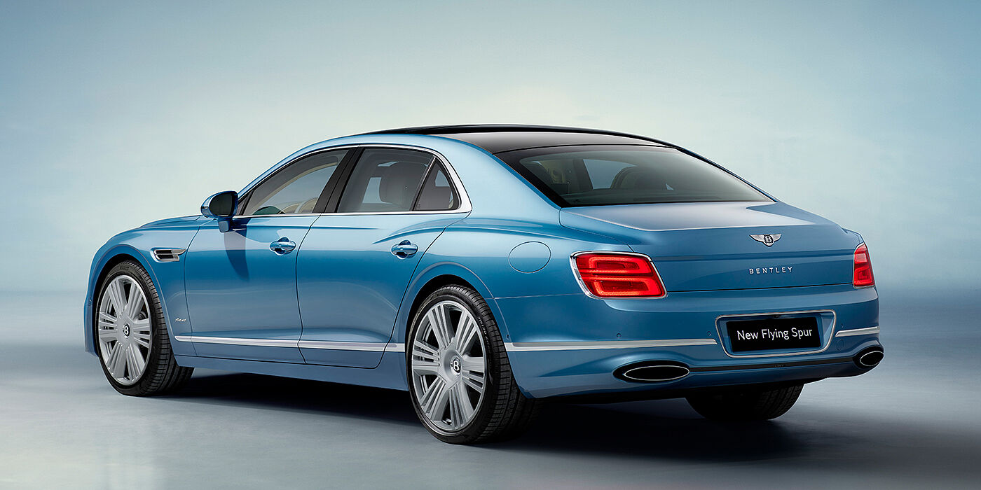 Bentley Bahrain New Bentley Flying Spur Azure sedan rear view in Light windsor blue by Mulliner paint with 22 inch Azure wheels and chrome exterior details