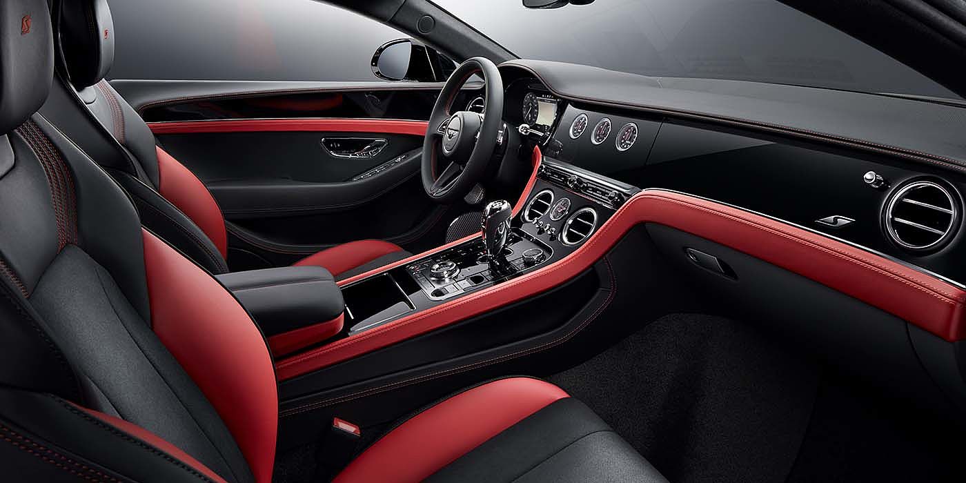 Bentley Bahrain Bentley Continental GT S coupe front interior in Beluga black and Hotspur red hide with high gloss Carbon Fibre veneer