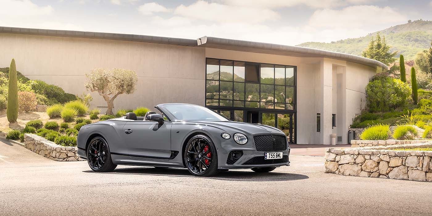 Bentley Bahrain Bentley Continental GTC S convertible in Cambrian Grey paint front 34 static near house