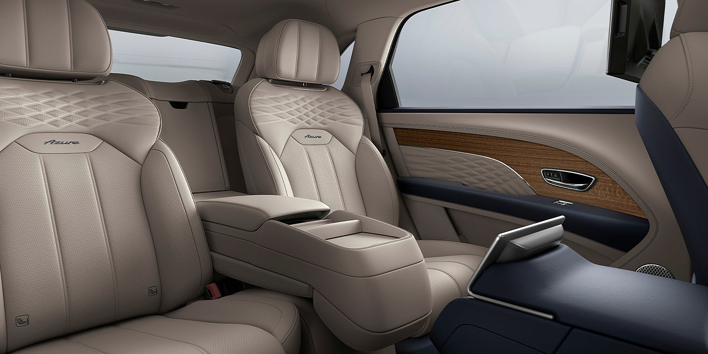 Bentley Bahrain Bentley Bentayga EWB Azure interior view for rear passengers with Portland hide featuring Azure Emblem in Imperial Blue contrast stitch.