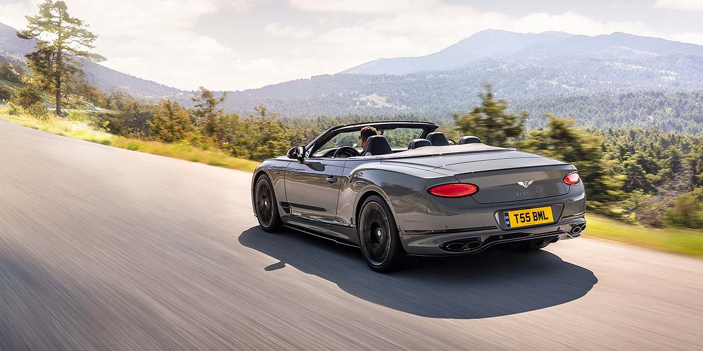 Bentley Bahrain Bentley Continental GTC S convertible in Cambrian Grey paint rear 34 dynamic driving
