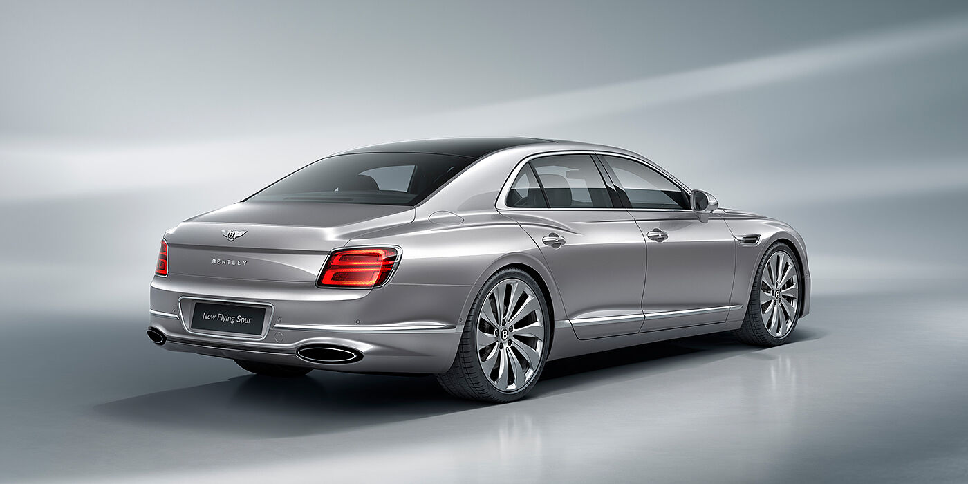 Bentley Bahrain New Bentley Flying Spur sedan rear view in Silverlake paint with ten spoke wheels and chrome matrix grille