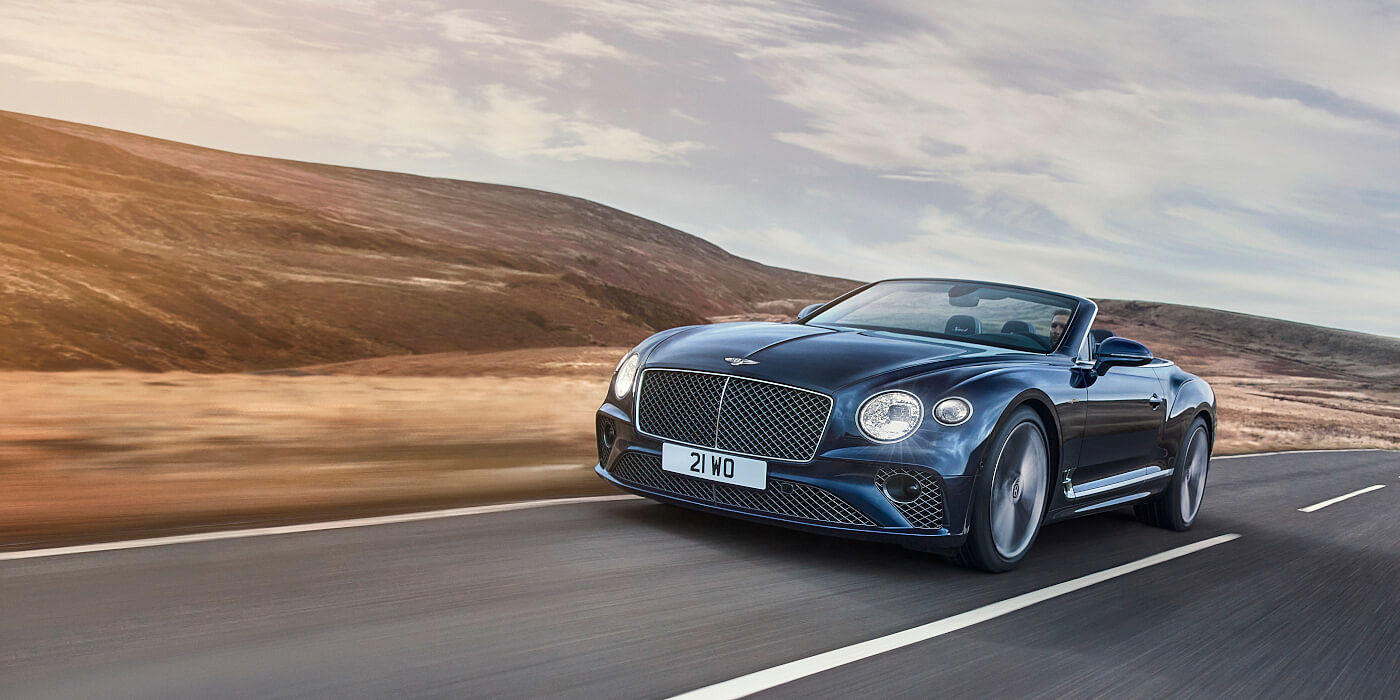 Bentley Bahrain Bentley Continental GTC Speed convertible in Peacock paint side front 34 dynamic