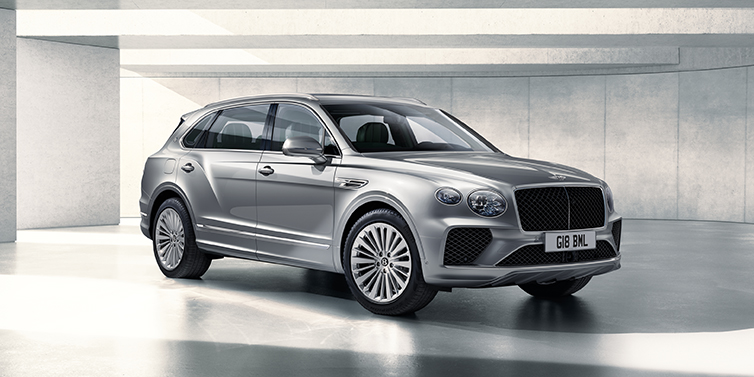 Bentley Bahrain Bentley Bentayga Extended Wheelbase SUV front three quarter in Moonbeam paint with a grey background