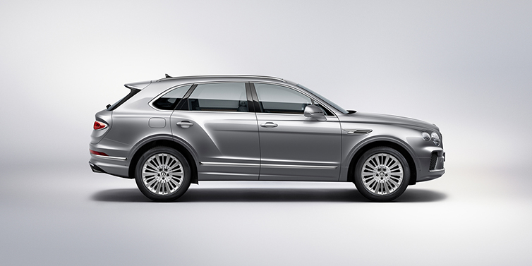 Bentley Bahrain Bentley Bentayga SUV side profile in Moonbeam silver paint against white background featuring 21 inch 5 spoke wheels